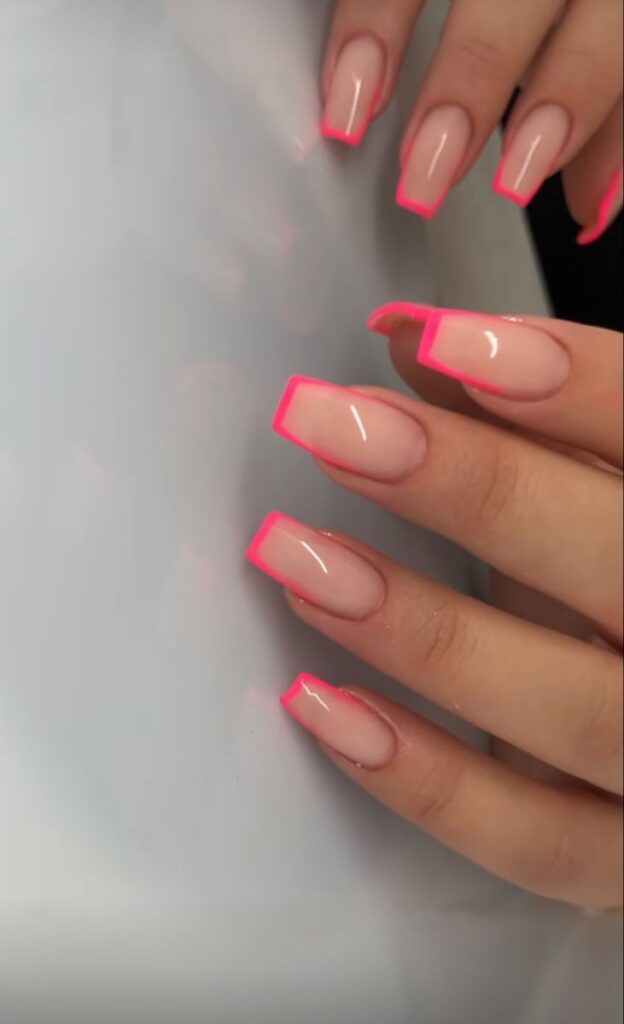 Medium-to-long square-shaped nails featuring a high-gloss sheer nude base coat, framed by a precise, ultra-thin micro outline of bright neon pink along the tips and side edges.