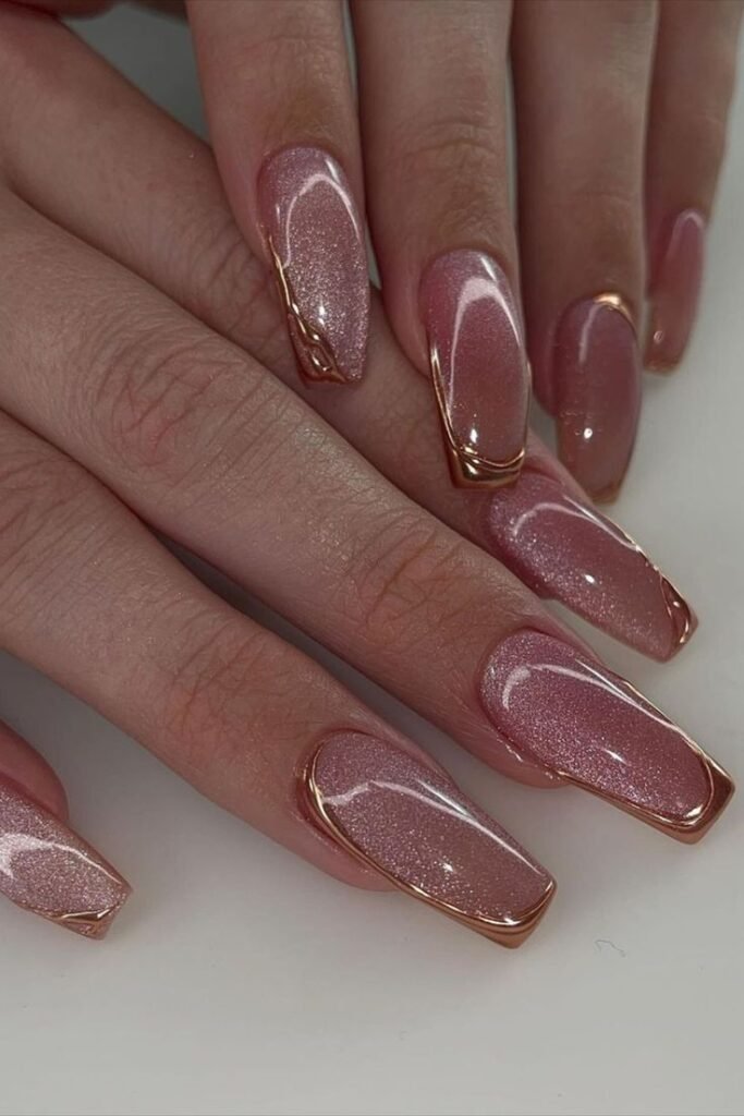 Rose gold cat eye nails with a magnetic shimmer and gold chrome outline on square-shaped nails.
